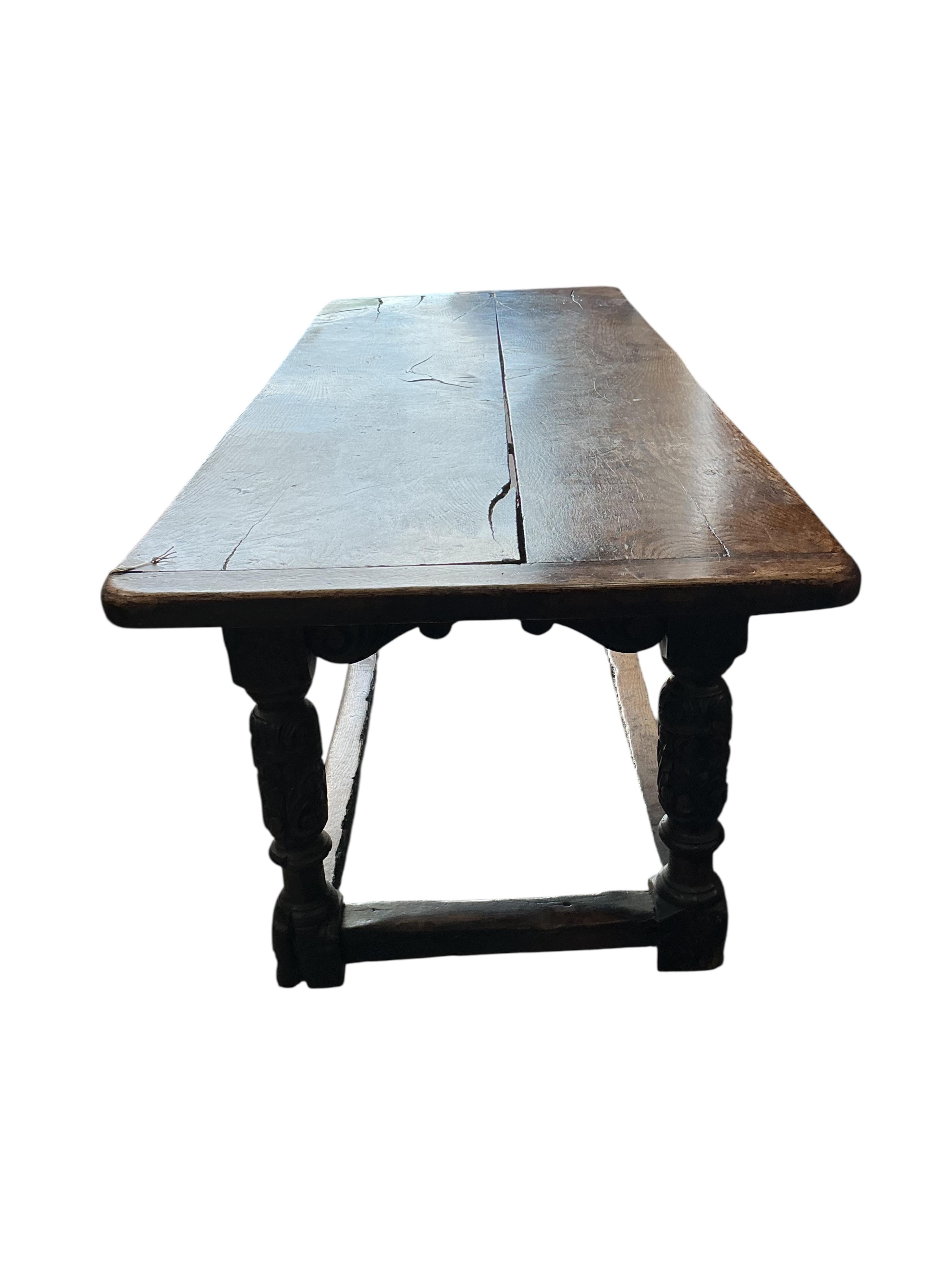 A 17th century style carved oak rectangular refectory table, incorporates old timber, width 198cm, depth 75cm, height 76cm